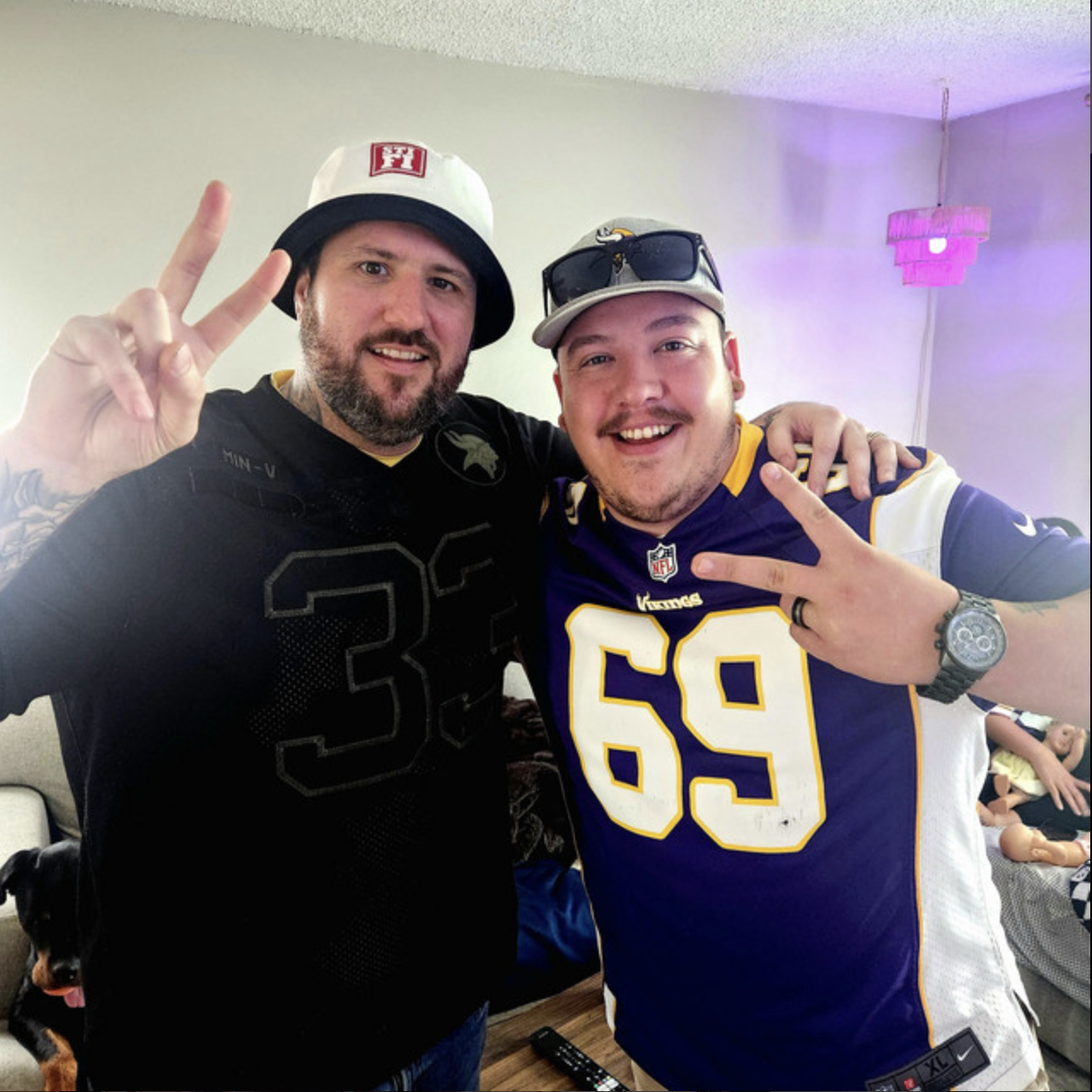 Cody P. with a friend, peace signs